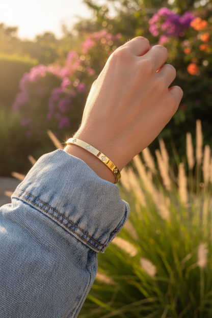 Close-up of lucky flower bangle on SA woman's wrist