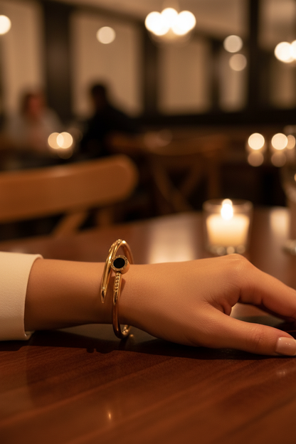 Close-up of Roman numeral bangle on woman's wrist at SA restaurant
