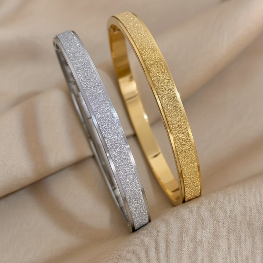 Gold and silver matte bangles on linen