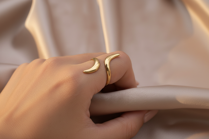 Gold Horn Ring on Tanned Hand