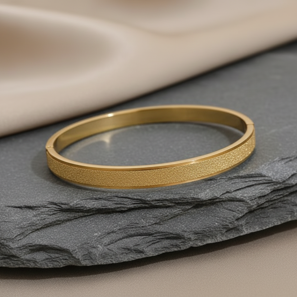 Gold matte bangle on satin