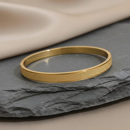 Gold matte bangle on satin