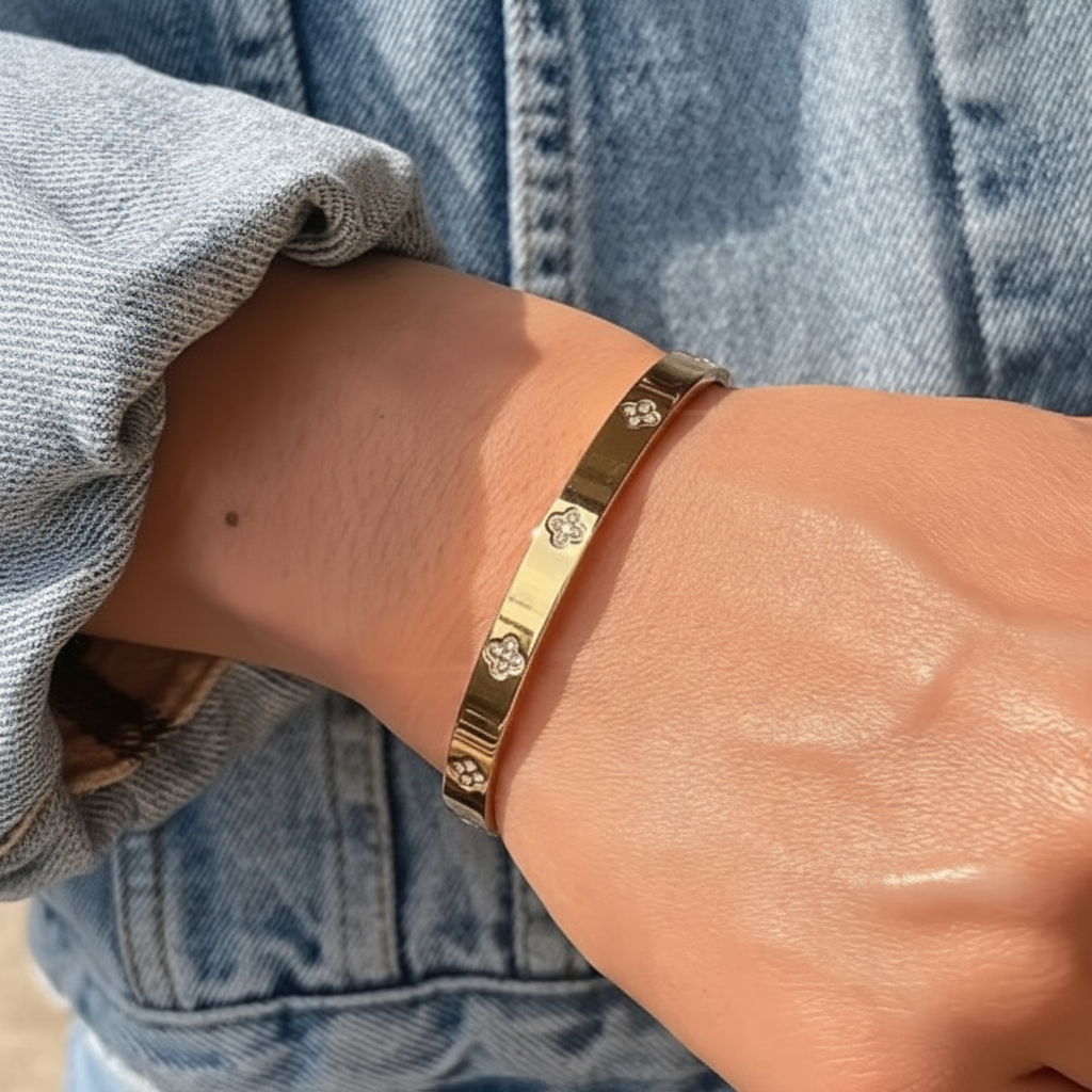 Lucky flower bangle on wrist with denim jacket