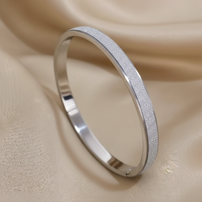 Silver matte bangle on satin